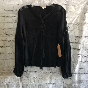 Black shirt by Jella Couture.  Size Small.  NWT.